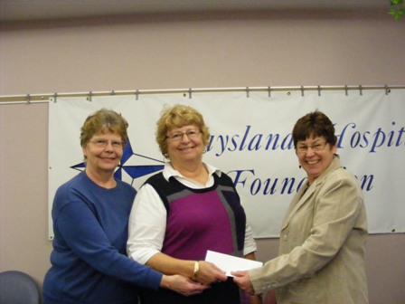 DHC_Ladies_Auxiliary_Purchases_5000_Brick_for_New_Daysland_Clinic_pictured_with_Martha_WaldorfFoundation_chair_-small.jpg